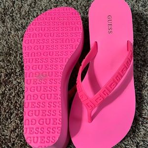Guess Hot pink wedge flip flops
